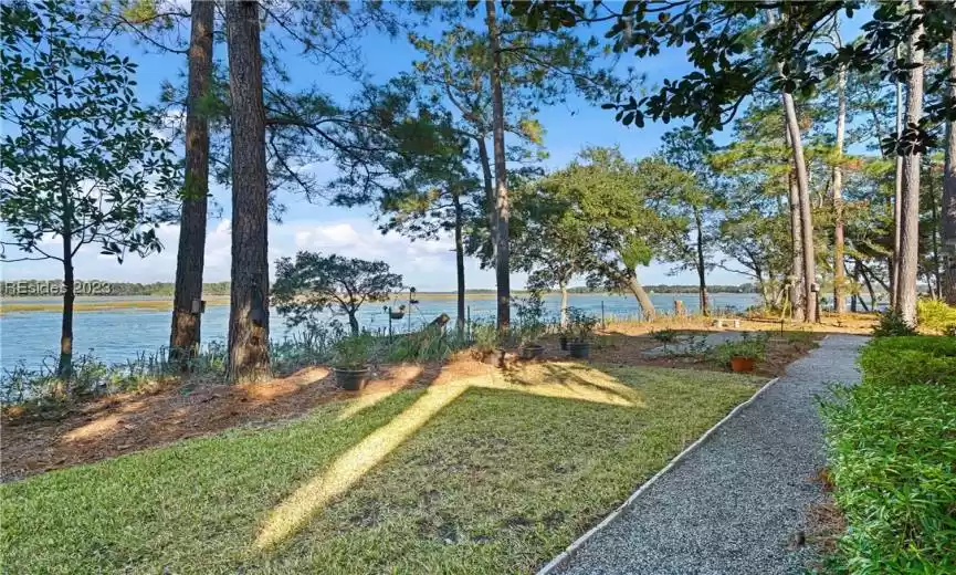 View of yard with a water view