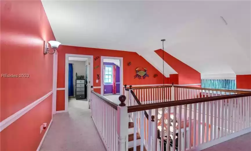 One of the highlights of this second floor is the generous loft-style walkway. This open space is perfect for a variety of uses, whether you'd like a home office, a reading nook, or a play area for the kids. The open design adds a sense of spaciousness and connectivity to the home.