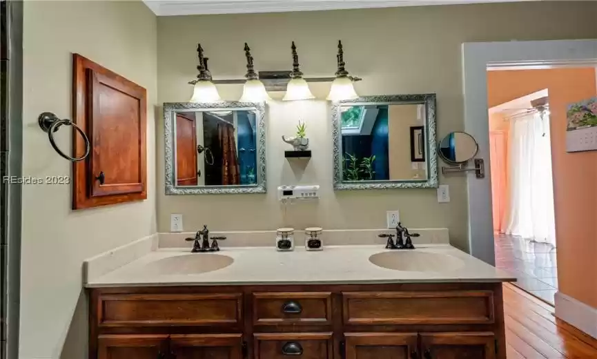 Turning your attention to the double sink vanity, it's a perfect blend of form and functionality. The elegant countertop offers ample space for your morning routine, and the dual sinks ensure there's no need to jostle for space. With well-placed mirrors and lighting, getting ready for the day or winding down in the evening is a breeze.