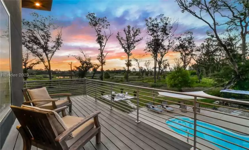 EXTERIOR TREX DECK BALCONY OFF OWNERS SUITE BATHROOM. THE PERFECT PLACE FOR SUNRISE AND COFFEE TO GET YOUR DAY STARTED.