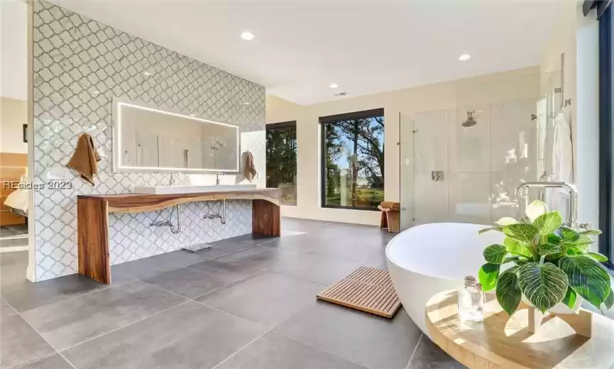 OWNERS SUITE BATH WITH AMAZING MONKEY POD WOOD VANITY AND SMART HOME MIRRORS