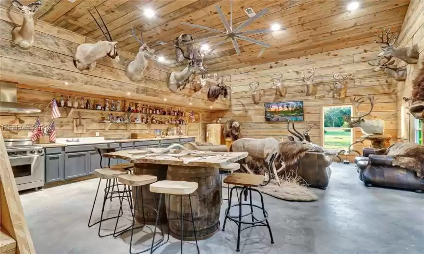 1,100 SQFT OF HEATED AND COOLED AWESOMENESS! FULL KITCHEN W/ DACOR APPLIANCES, AN OLD-FARMHOUSE SINK, FULL BED AND BATH WITH STAINED CONCRETE AND SPRAY FOAM INSULATED WALLS.