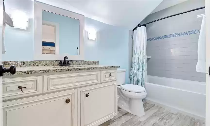 Guest bath with tub/shower combination.