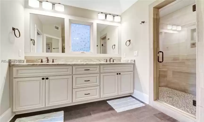 Primary bath has a large walk-in shower.