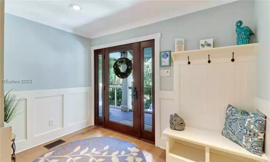 Large foyer with storage for outdoor clothes.