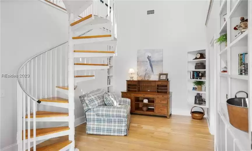 Library with bedroom and relaxing space up.