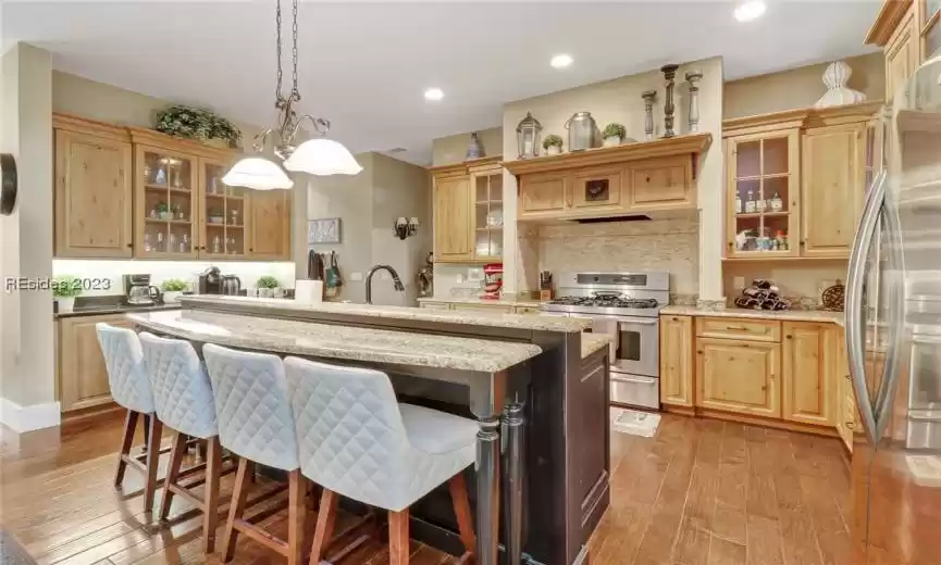 Custom rich toned wood cabinetry.