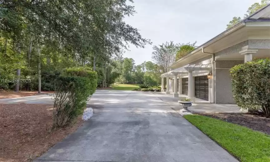 3 car garage with epoxy flooring and storage