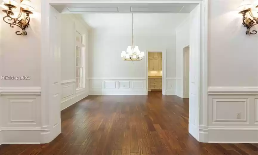 Dining room with view into butler's pantry/wet bar.