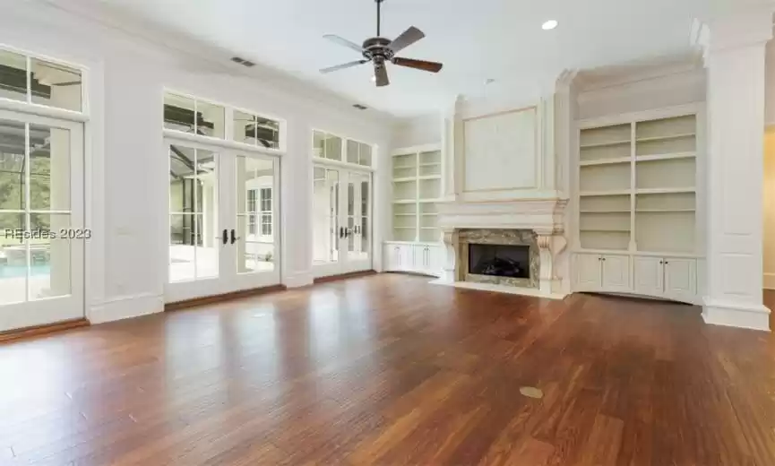 Main living area with fireplace and custom built-ins.