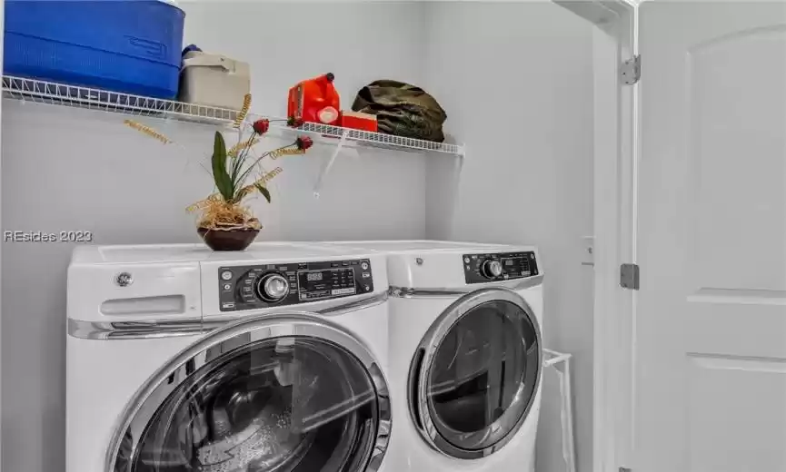 Laundry area features premium washer and dryer ... both stay.