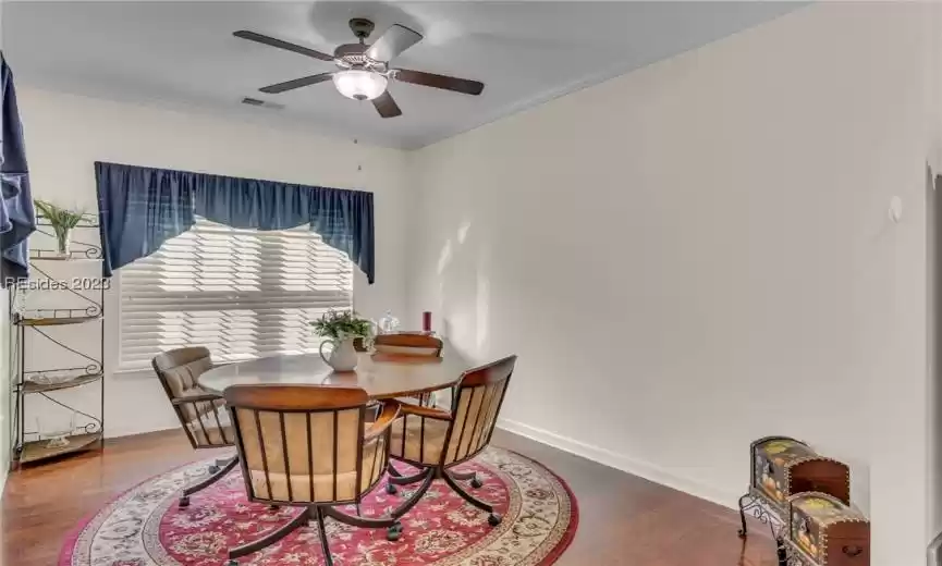 Informal dining area just beyond the kitchen features fan/light and large window to let in the natural light.