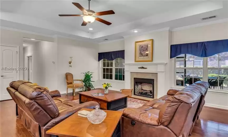 Another look at the great room/living room with a glimpse of the large screened porch just beyond.