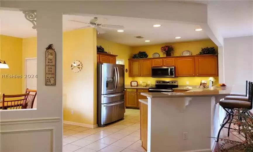 Beautiful tile floors in all wet areas. Maple cabinets and hard surface countertops.