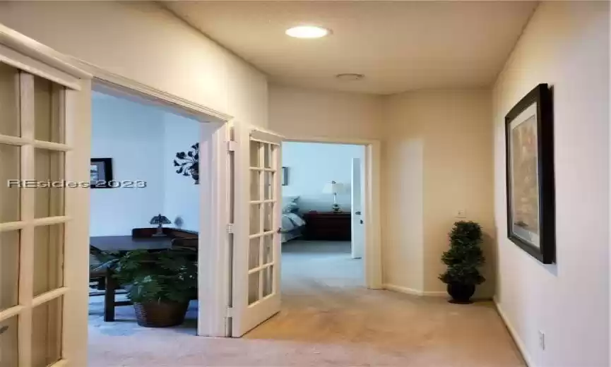 Separate hallway to den/study and master suite. Very private!