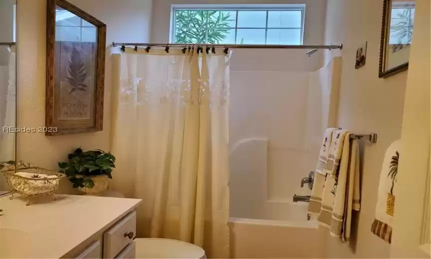 The hall bath is adjacent to the guest bedroom.