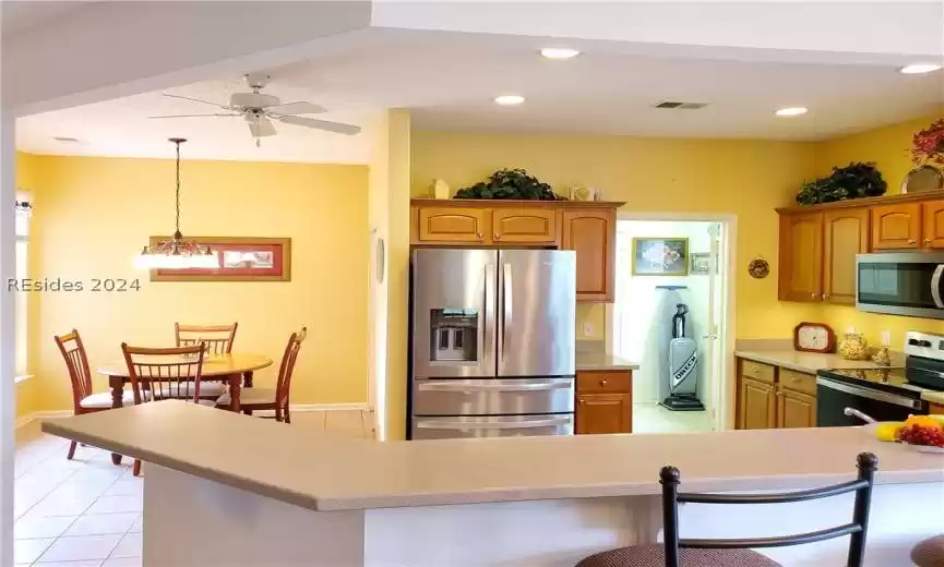 Spacious kitchen, adjoining eat-in area and large pantry. The laundry room is just off the kitchen with pass through to large 2 car garage.
