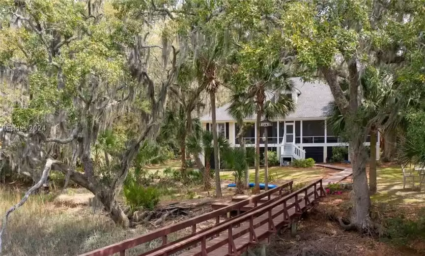 View of yard featuring a sunroom