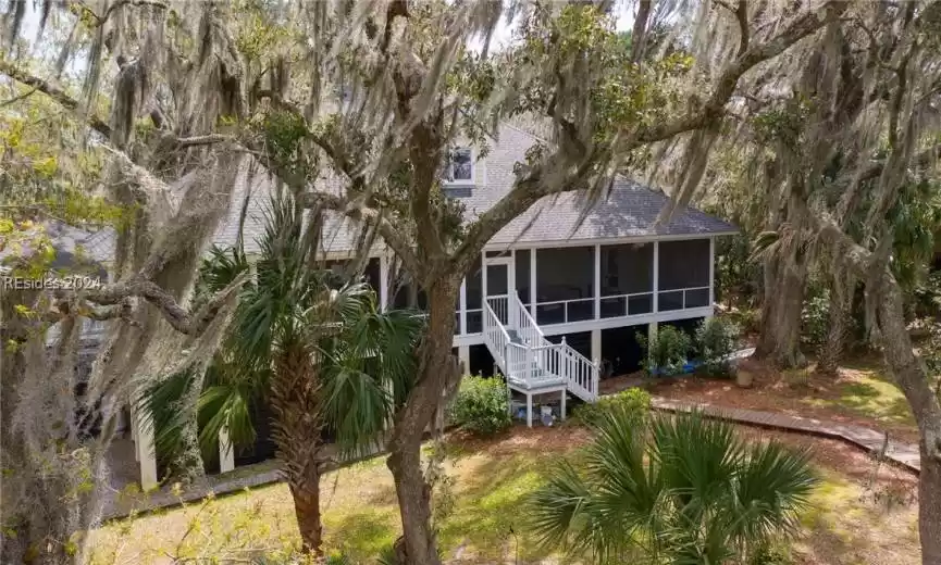View of front of property featuring a sunroom