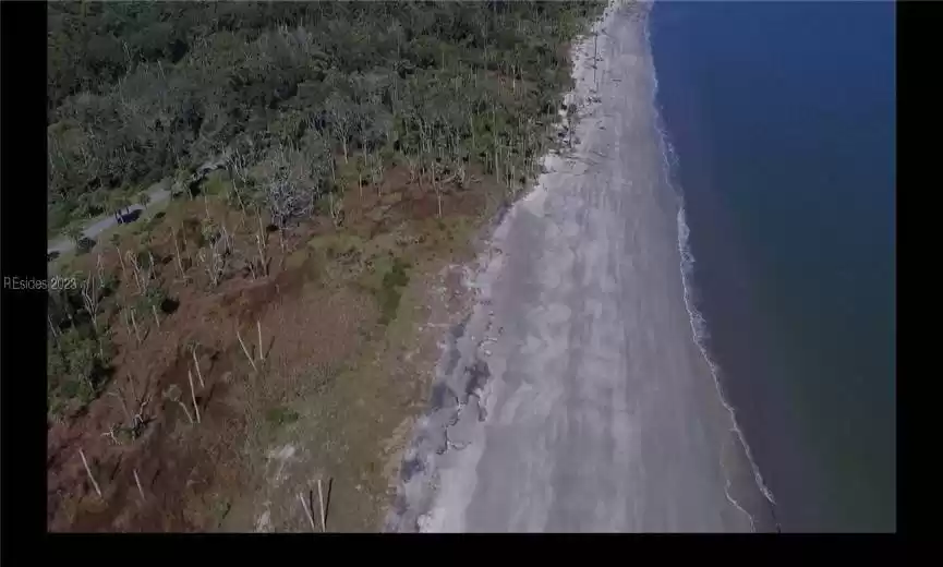 Drone / aerial view featuring a beach view and a water view