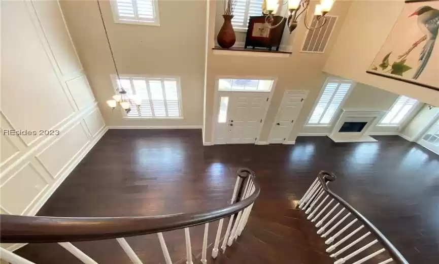 View from top of stairs, entry, dining and living room