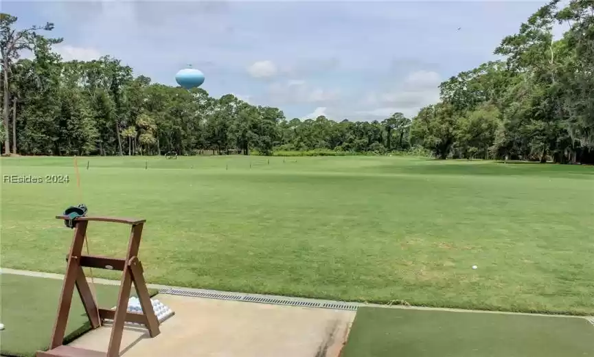 View of nearby features with a lawn