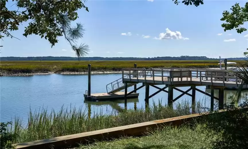 Dock area featuring a water view