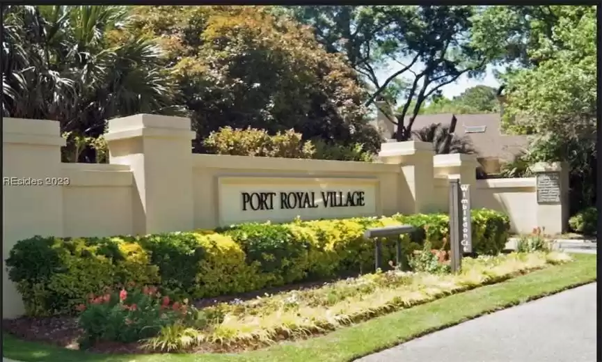 View of community / neighborhood sign in the beautiful Port Royal Village Community in Port Royal Plantation. This condo neighborhood boasts several different 1,2 & 3 bedroom condos all within walking distance to the white, sandy beaches of Hilton Head