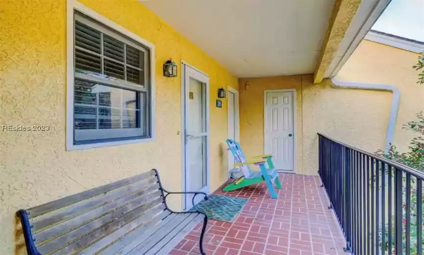 Charming porch and bench View of entrance to property. property affords two separate entrances and guest suites.