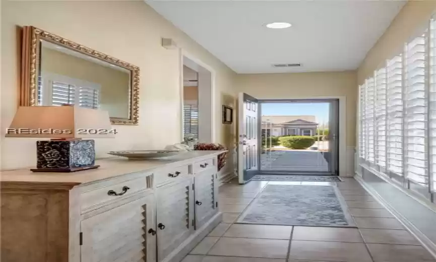Entryway with light tile floors