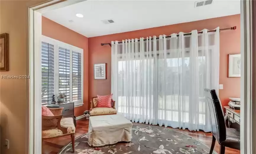 Living area with wood-type flooring
