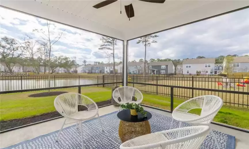 Screened-in Porch with lagoon view and ceiling fan
