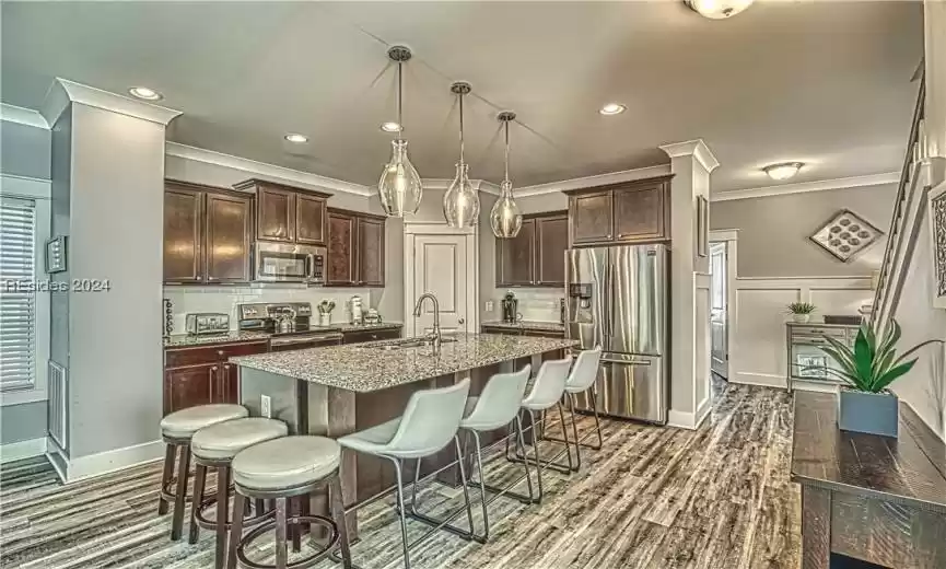 Large Kitchen with Stainless Steel Appliances and Granite Countertops.