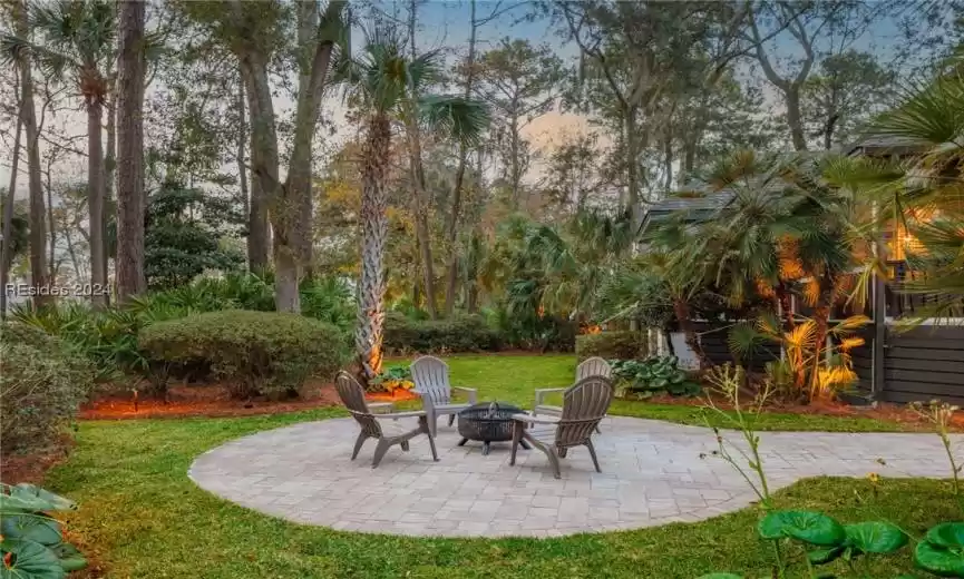 View of patio with a fire pit