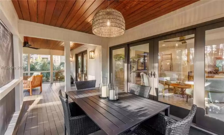 A continuation of the screened porch leads to a dining area outside. A great house to entertain family and friends.