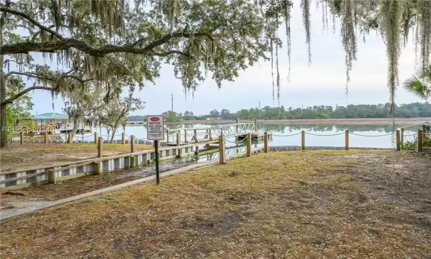Dock area featuring a water view