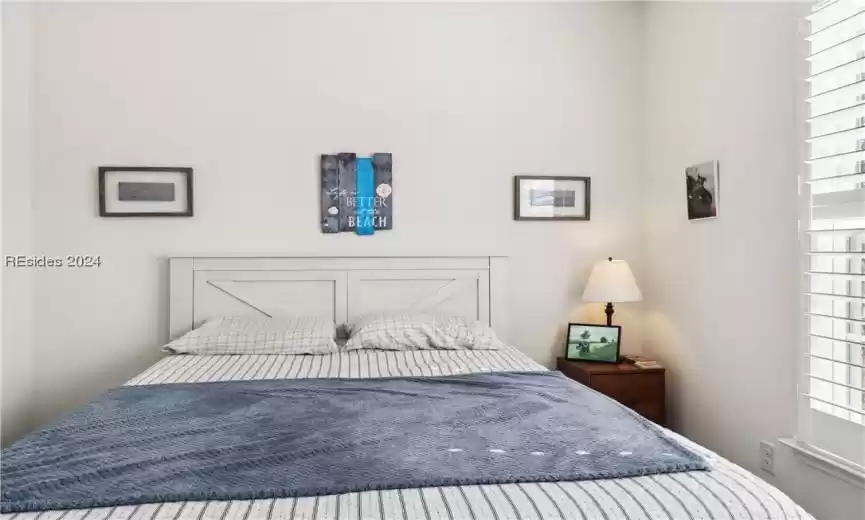 Bedroom featuring multiple windows