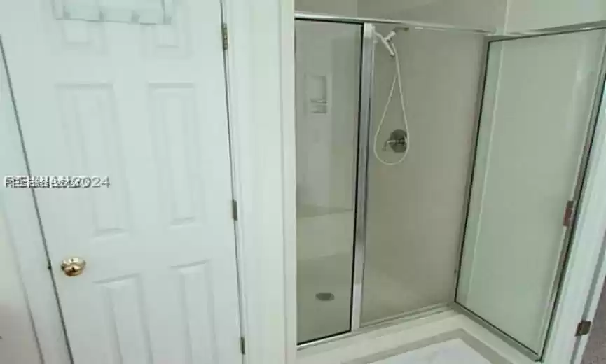 Bathroom featuring an enclosed shower