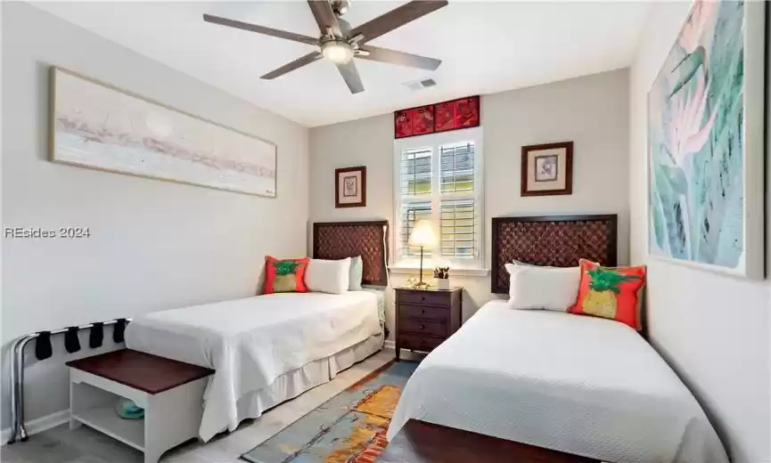 Bedroom featuring ceiling fan and light wood-type flooring