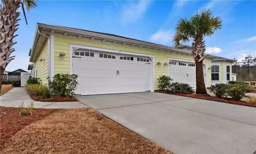 View of front of property featuring a garage
