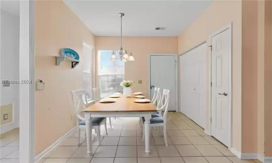 Options abound for the eat-in kithen!  Hiding behind the doors: garage access, washer + dryer, and a pantry, too!