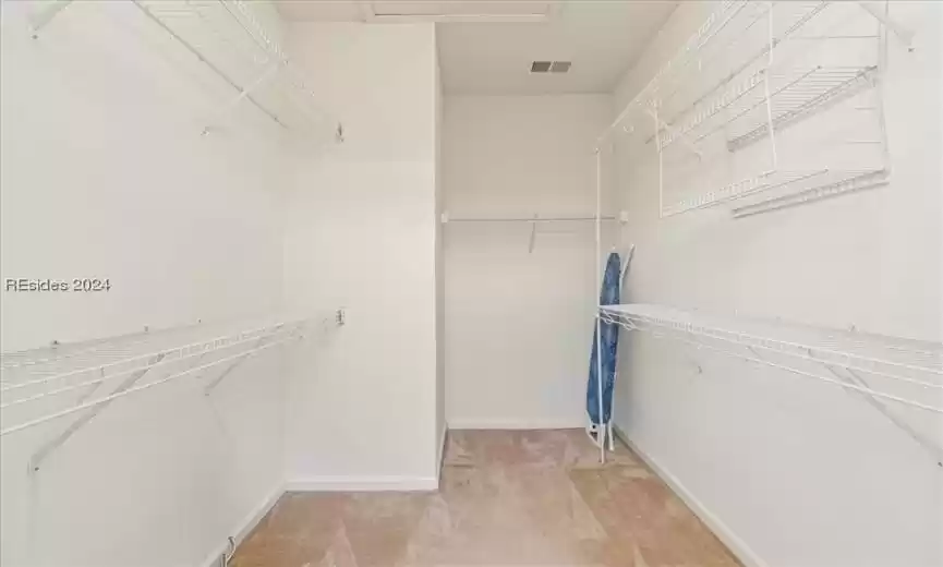 The H-U-G-E primary closet is accessed from the primary bathroom.