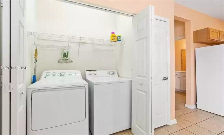 I love that the laundry is INSIDE the home!  Many floorplans have the washer + dryer in the garage instead.