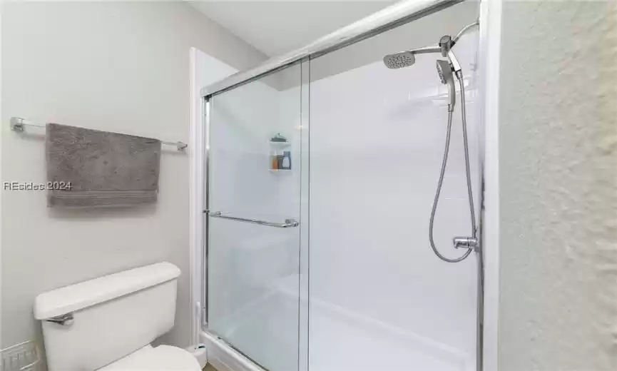 Bathroom featuring toilet and walk in shower