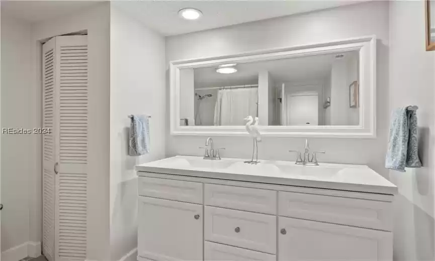 Full Bathroom with newer vanity and mirror.