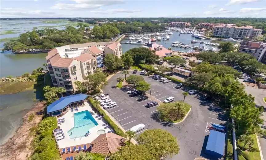 Community Pool and hot tub overlooking Broad Creek - Shelter Cove Harbour in the background and the newer bike storage for Captains Quarters in the bottom right corner.