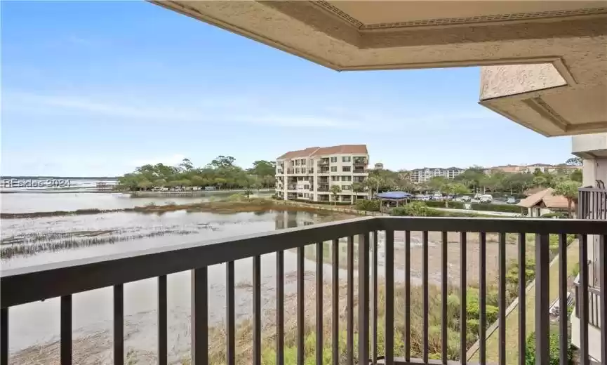 Welcome to Captains Quarters #250 in Shelter Cove. This is your Beautiful view of Broad Creek and the community pool from your 3rd floor balcony.