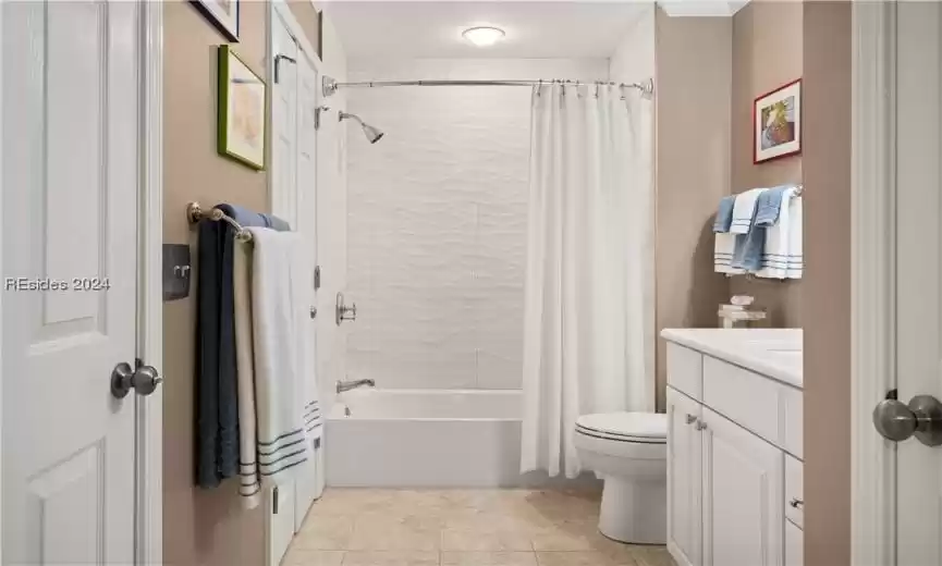 Another view of Guest Bathroom showing doors into laundry room. The guest room has direct access to this bathroom as well.