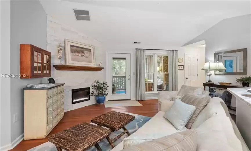 Another angle showing the perfected use of space. Door leads to one of the best patios and views in this complex. All furniture stays except sofa table on far wall.