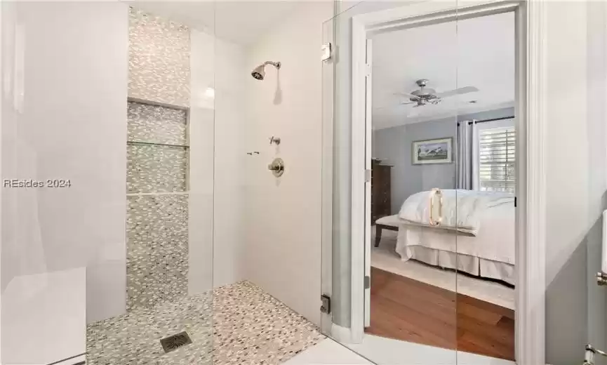 A primary bathroom that is Head and Shoulders Above the Rest! Look at the detail in this shower tile- wow!!